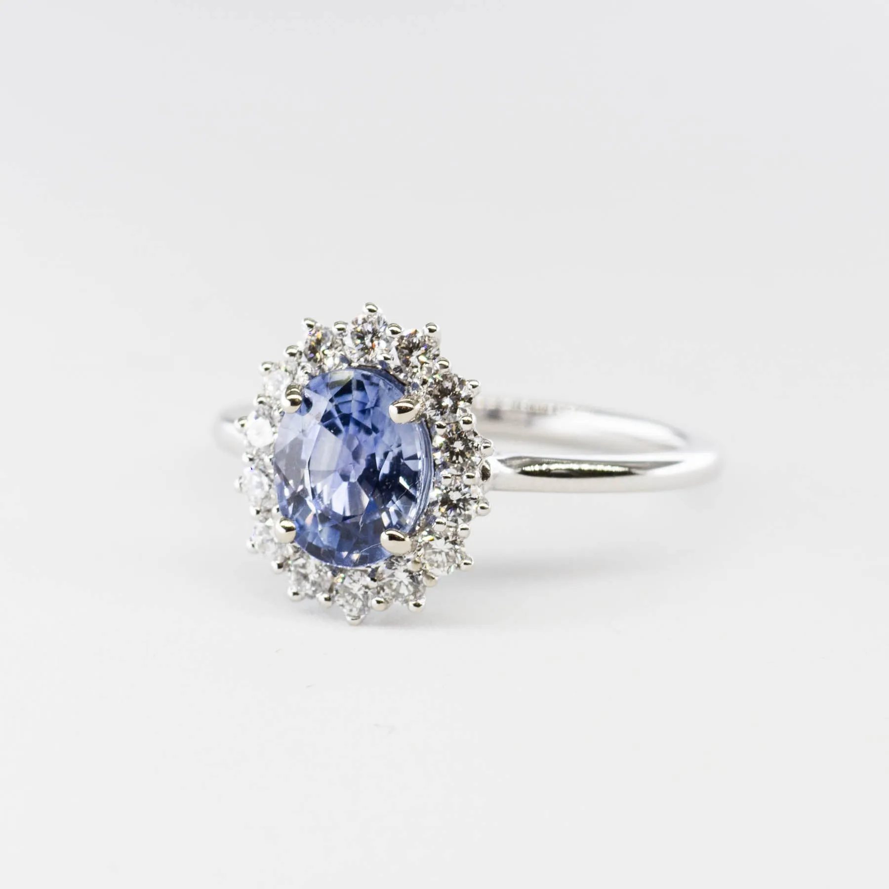 100 Ways Jewelry 100 Ways' Oval Sapphire and Halo Diamond Ring | 1.62ct, 0.38ctw | SZ 6.75 |