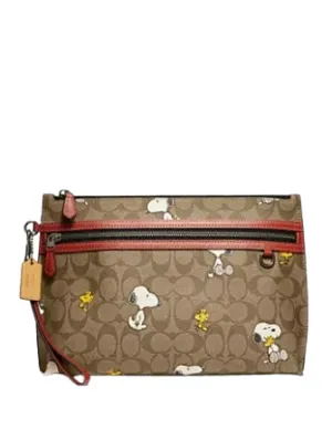 Coach Coach X Peanuts Carry All Pouch In Signature Canvas With Snoopy Woodstock Print Coach Bags